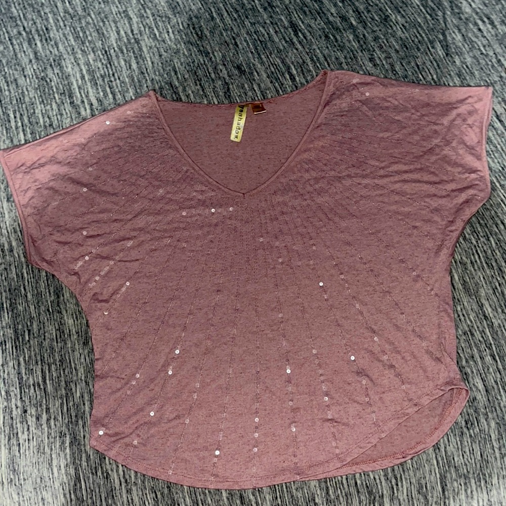 This is a Light purple shirt with sequence it’s in the size large